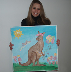 Jessica Rachlin Holding Up her Hand-Painted Donated Canvas Mural for the Pediatric ER - Great Volunteer