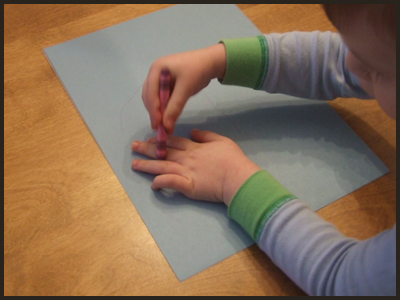 Have Your Child Trace His Hand on the Colored Construction Paper