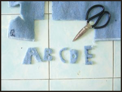 Now cut the alphabet letters out of the felt for Alphabet Letters Tactile Guessing Game Craft