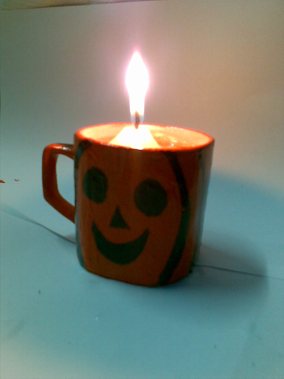 make halloween jack o lantern candle holder with an old candle light artists