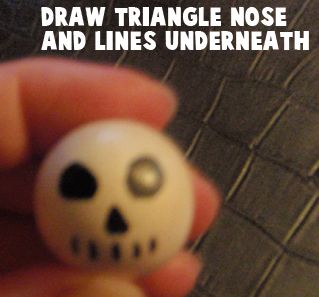 Draw a triangle nose and lines underneath