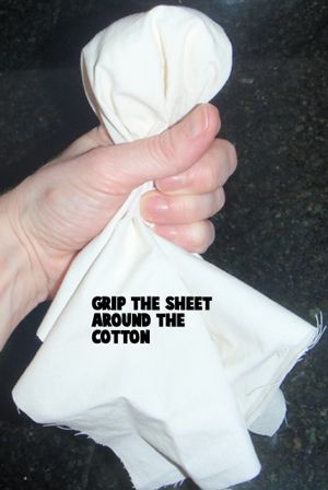 Grip the sheet around the cotton