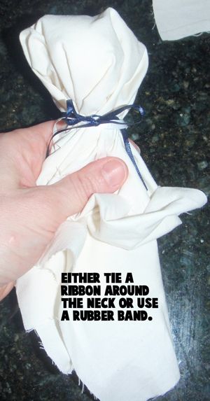 Either tie a ribbon around the neck or use a rubber band