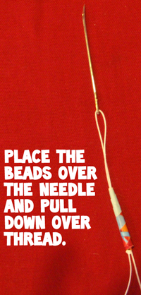 Place the beads over the needle and pull down over thread.