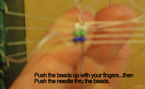 Push the beads up with your fingers... then push the needle thru the beads.