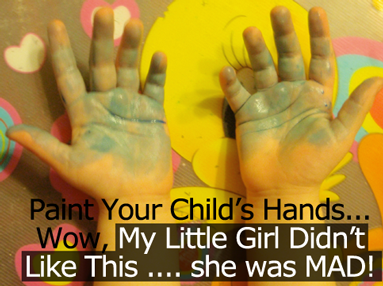 Paint both your child's hands.