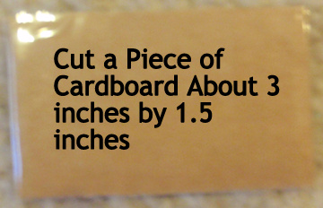 Cut a piece of cardboard about 3 inches x 1.5 inches.