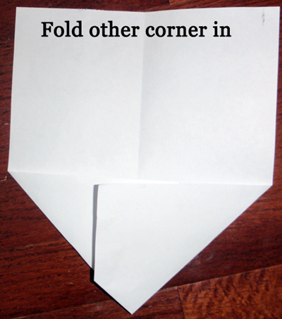 Fold other corner in.