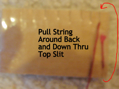 Pull string around back and down thru top slit.