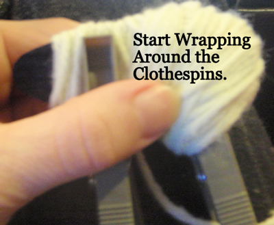 Start wrapping yarn around the clothespins.