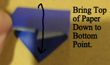 Bring top of paper down to bottom point.