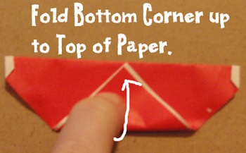 Fold bottom corner up to top of paper