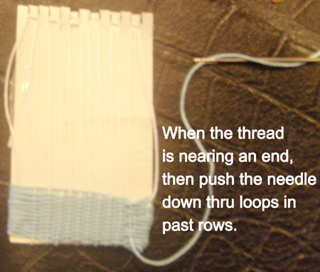 When the thread is nearing the end, then push the needle down thru loops in past row.