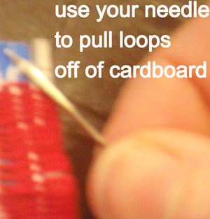 Use your needle to pull the loops off of cardboard.