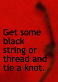 Get some black string or thread and tie a knot.