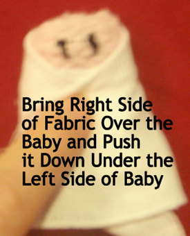 Bring right side of fabric over the baby