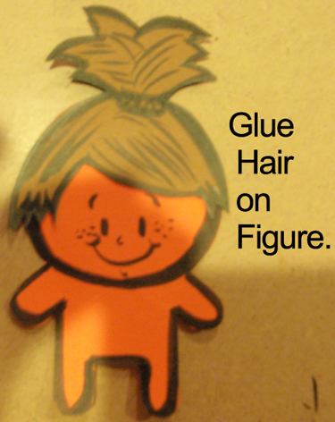 Glue hair on figure.