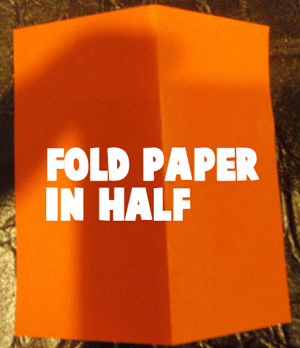 Fold paper in half.