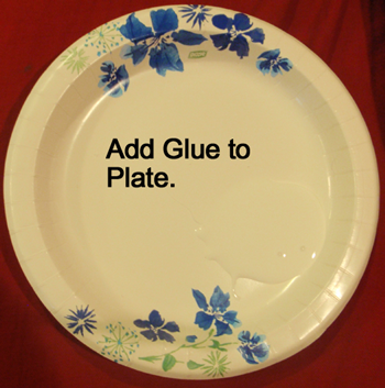 Add glue to a paper plate.