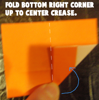 Fold bottom right corner up to center crease.