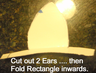 Cut out two ears... then fold rectangle inwards.