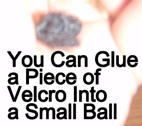 You can glue a piece of Velcro onto a small ball.