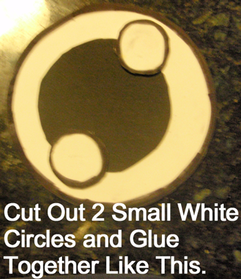 Cut out 2 small white circles and glue together like this.