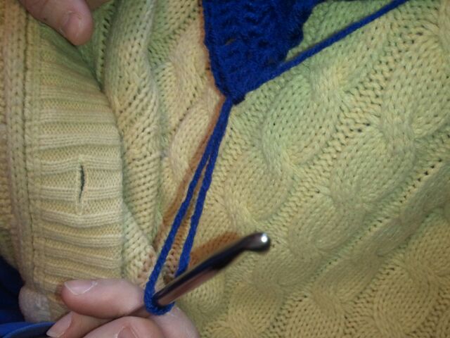 Pull crochet hook to give yourself a large loop to work with.