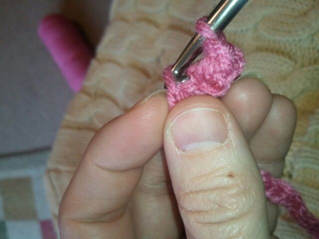 Push hook through 2nd stitch of crocheted blanket.