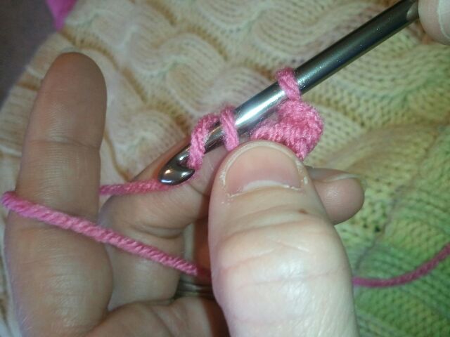Go under yarn with hook.  Pull that yarn through the first loop on the crochet hook.