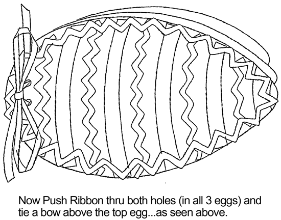 Now push ribbon thru both holes (in all 3 eggs) and tie a bow above the top egg