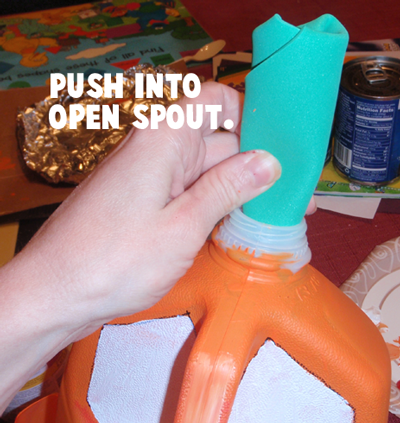 Push into open spout.