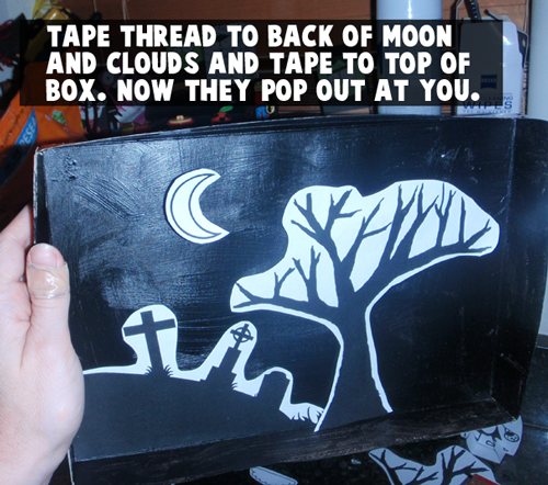Tape thread to back of moon and clouds and tape to top of box.