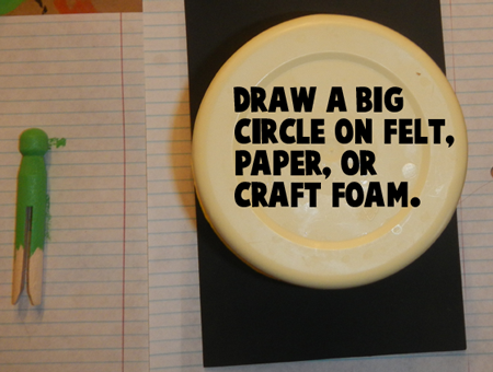 Draw a big circle on felt, paper or craft foam.