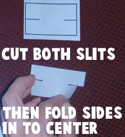 Cut both slits.  Then fold sides in to center.