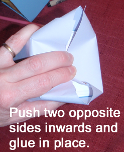 Push two opposite sides inwards and glue in place.
