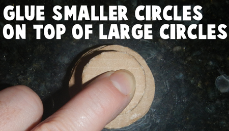 Glue smaller circles on top of large circles.