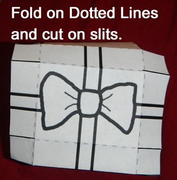 Fold on dotted lines and cut on slits.