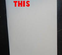 Fold a piece of paper in half the long ways.