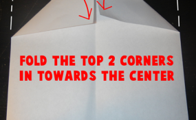 Fold the top corners in towards the center.