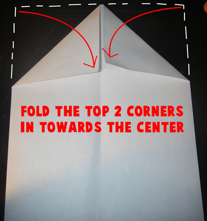 Fold the top corners in towards the center.