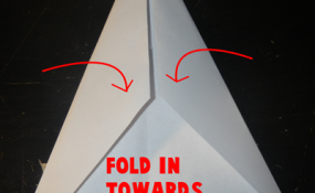 Fold in towards center line another time.