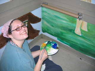 a wonderful artist painting the mt sinai zoo mural