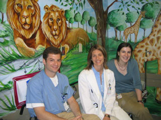 Doctors of Mt. Sinai Sitting Proudly in Front of the New Pediatric ER Treatment Room Zoo Mural